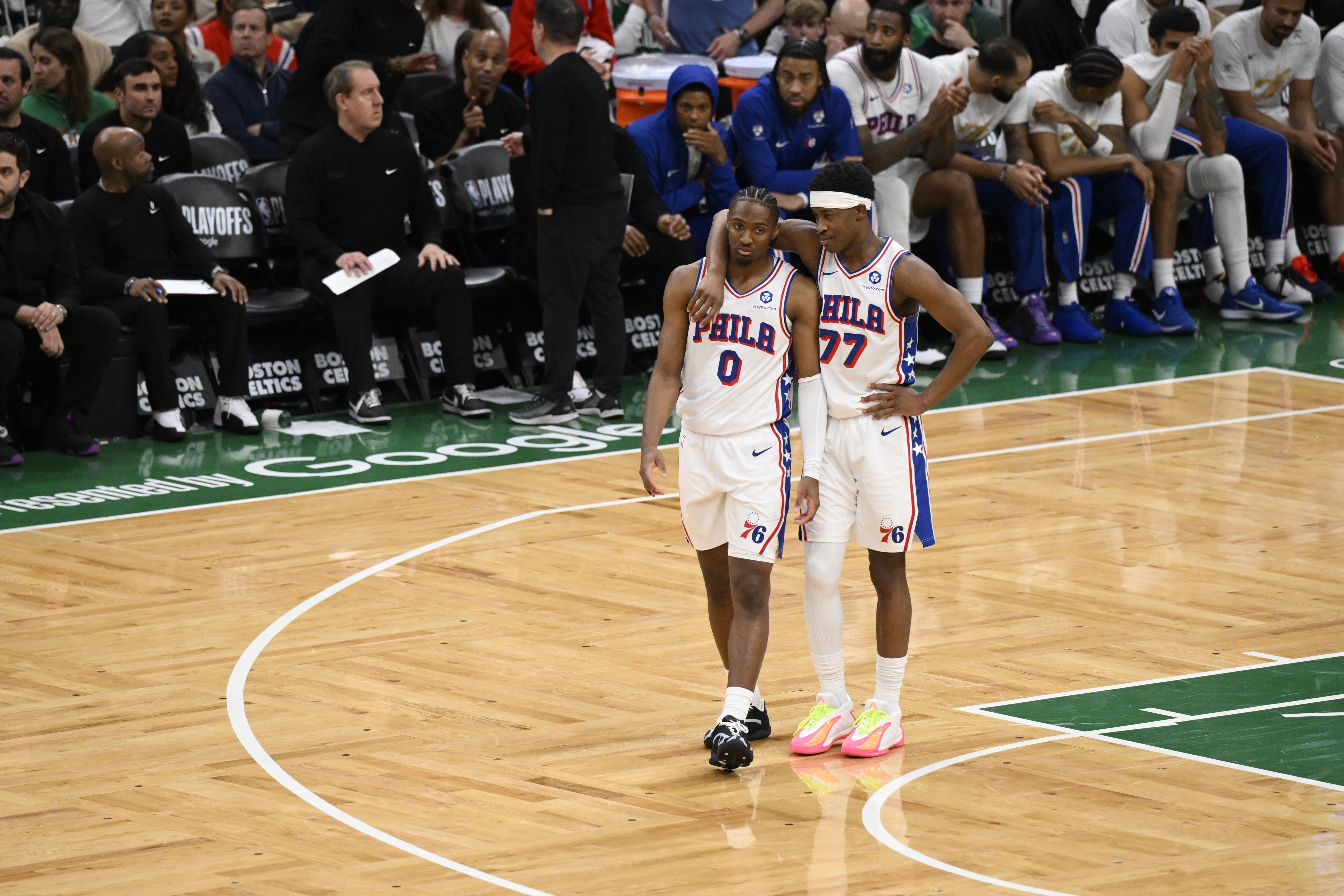 Tyrese Maxey #0 and VJ Edgecombe #77 of the Philadelphia 76ers talk during the game